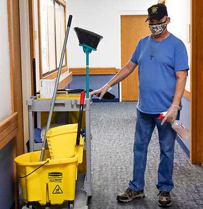 man with janitorial cart